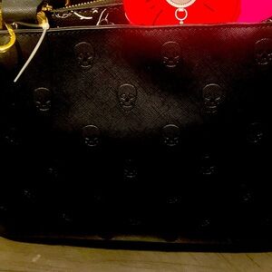 Betsy Johnson black embossed skull handbag